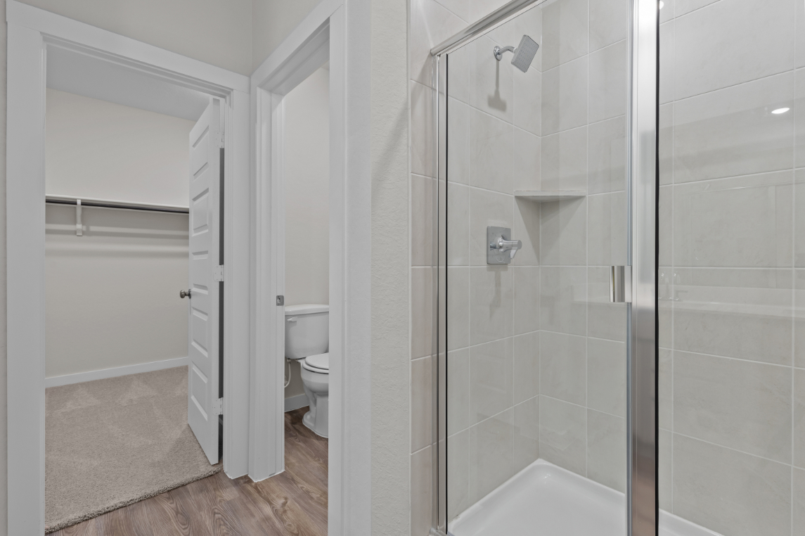 A bathroom with a glass shower.