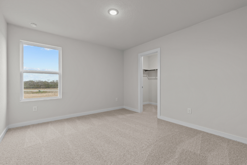 A room with a window and a door.