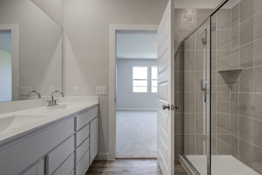 A bathroom with a glass shower.