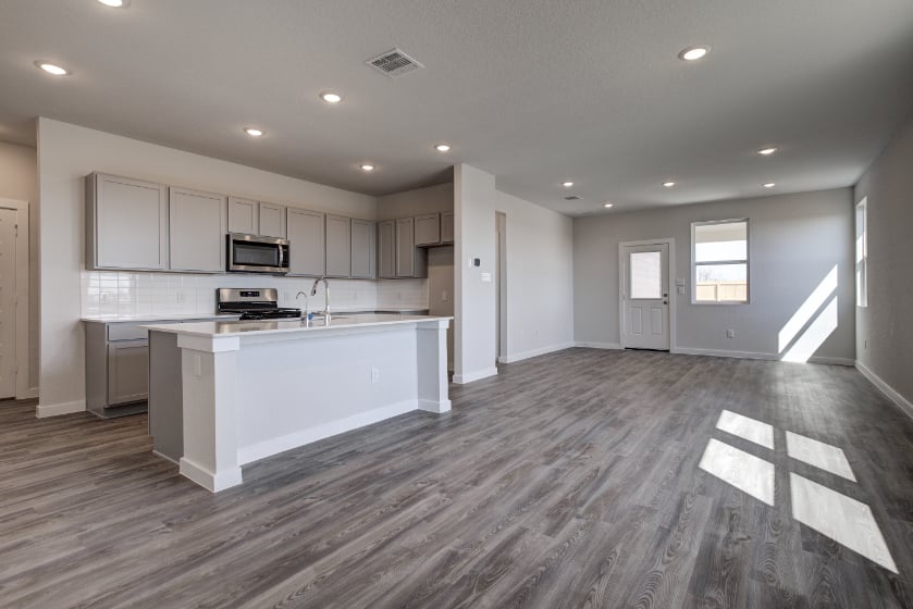 A large kitchen with white cabinets.