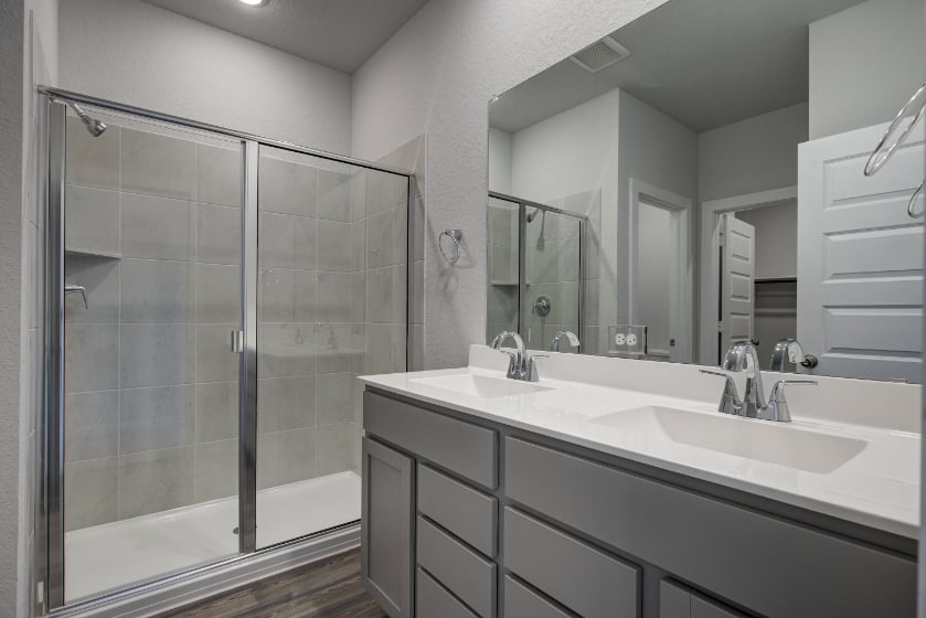 A bathroom with a glass shower.