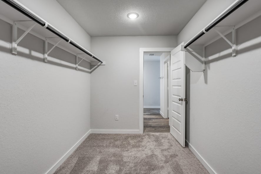 A hallway with white walls.