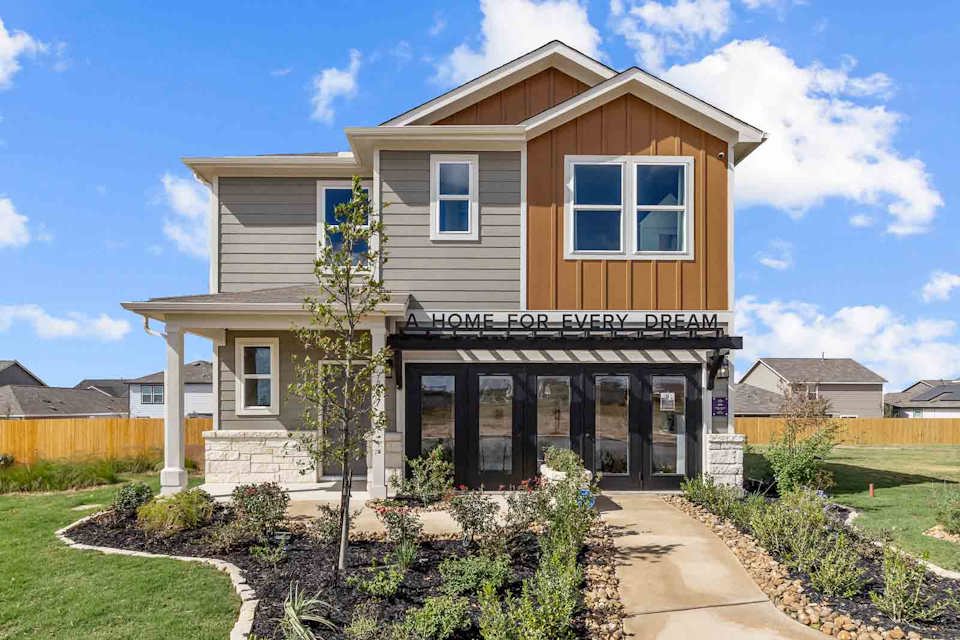 A house with a large front yard.