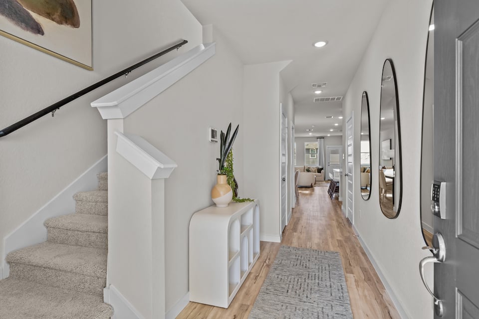A hallway with white walls.