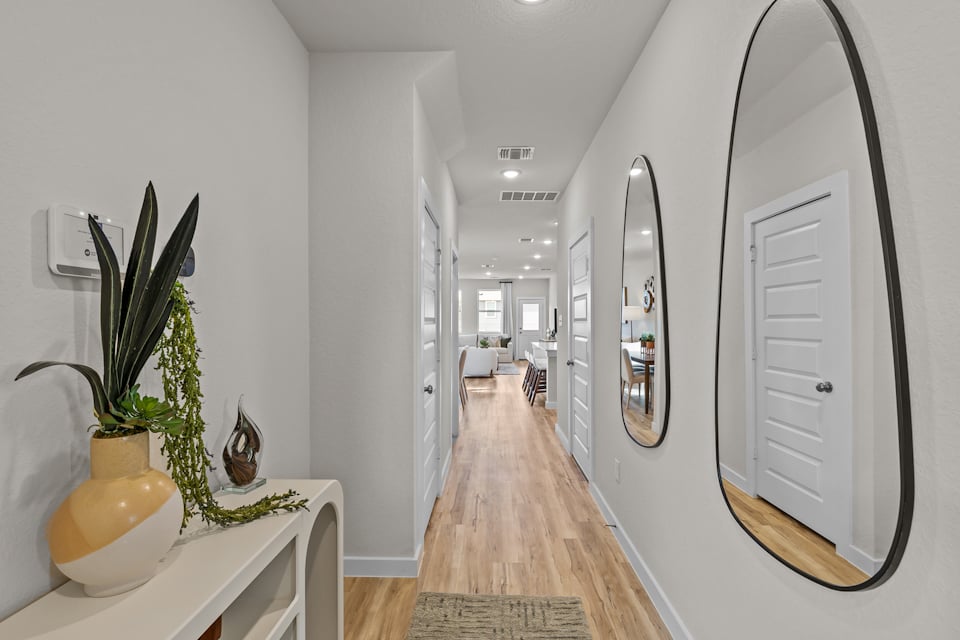A hallway with white walls.