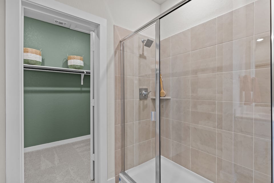 A shower with a glass door.