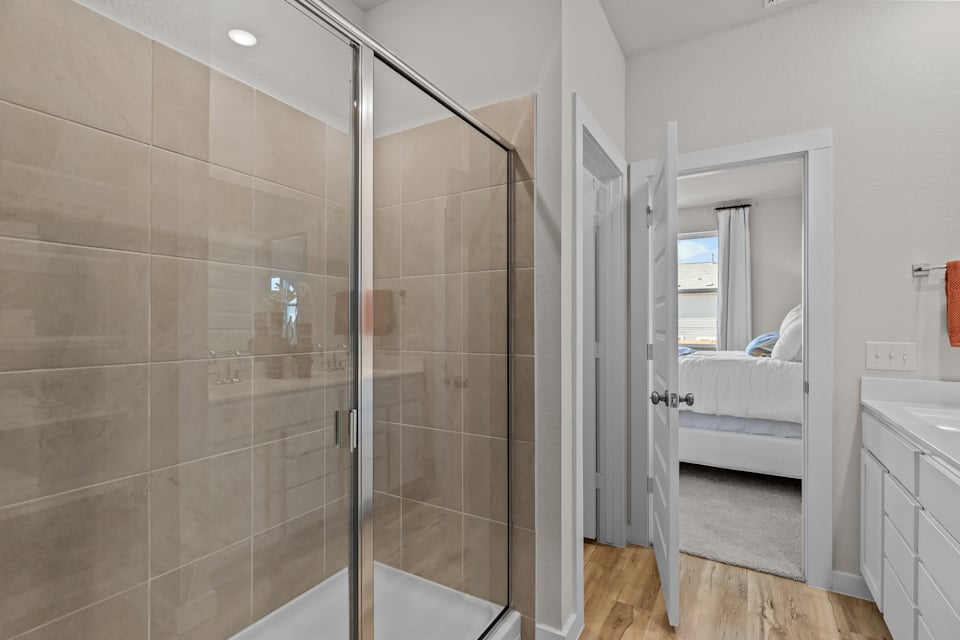 A bathroom with a glass shower.