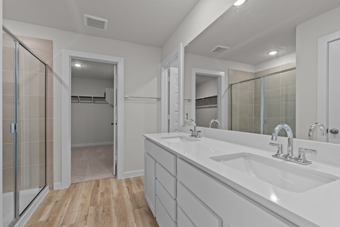 A bathroom with a glass shower.