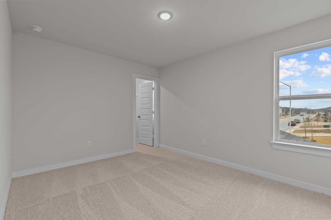 A room with a window and a door.