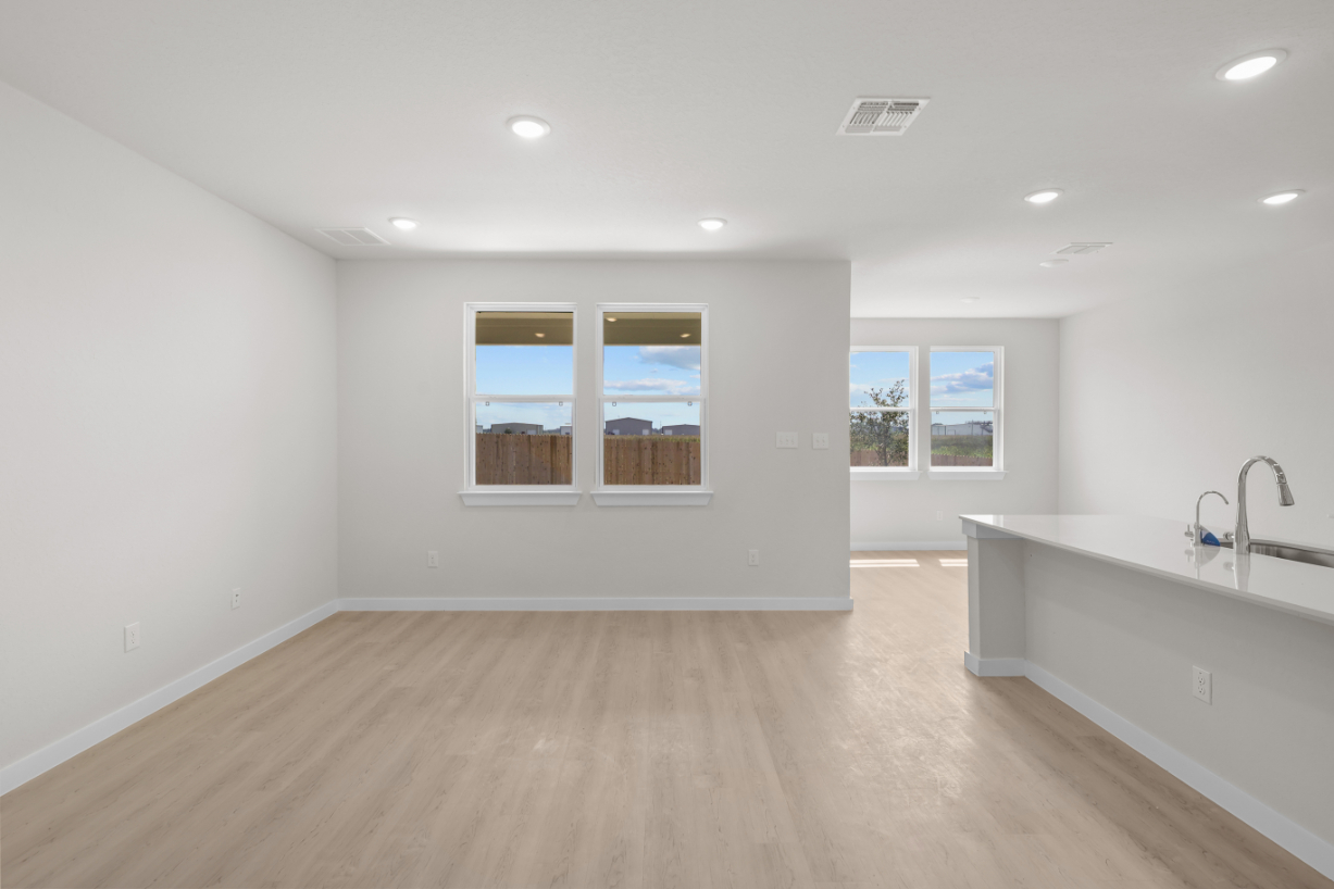 A room with a sink and a window.