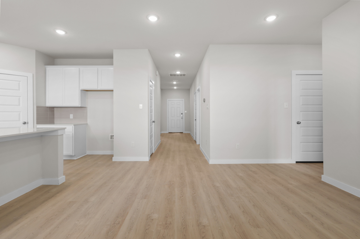 A room with white cabinets.