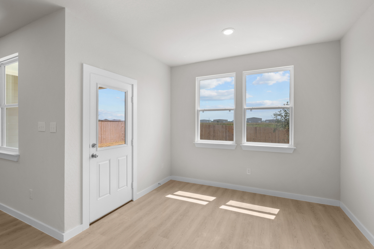 A room with a door and windows.