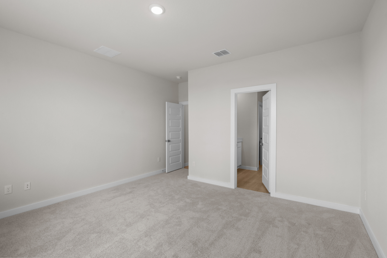 A hallway with white walls.