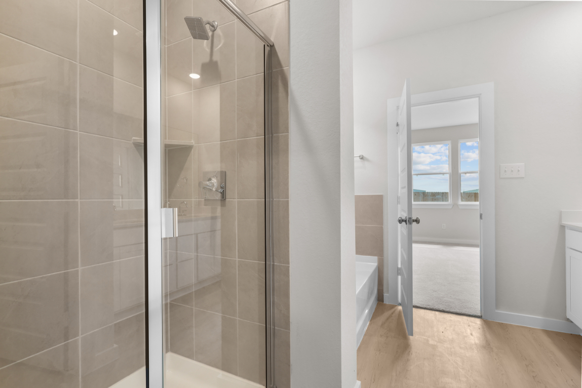 A shower with glass doors.