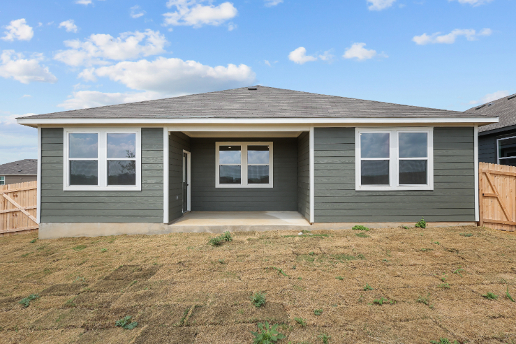 A house with a grass yard.