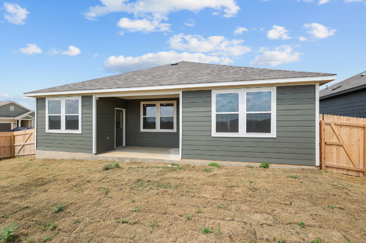 A house with a grass yard.