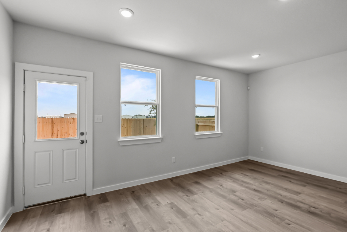 A room with a door and windows.