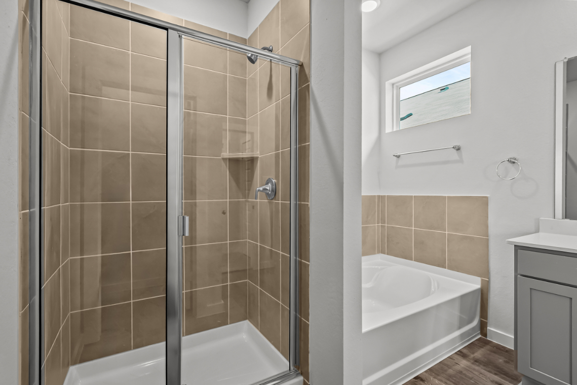 A bathroom with a glass shower.