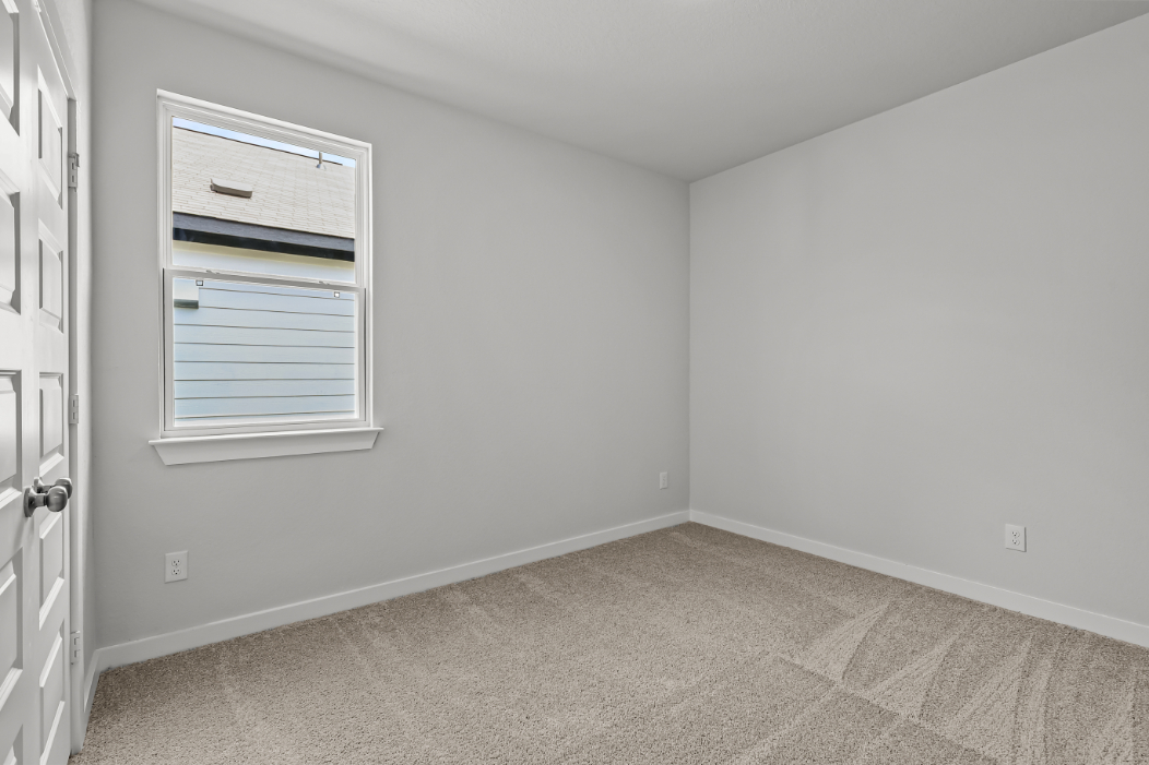 A room with a door and a window.