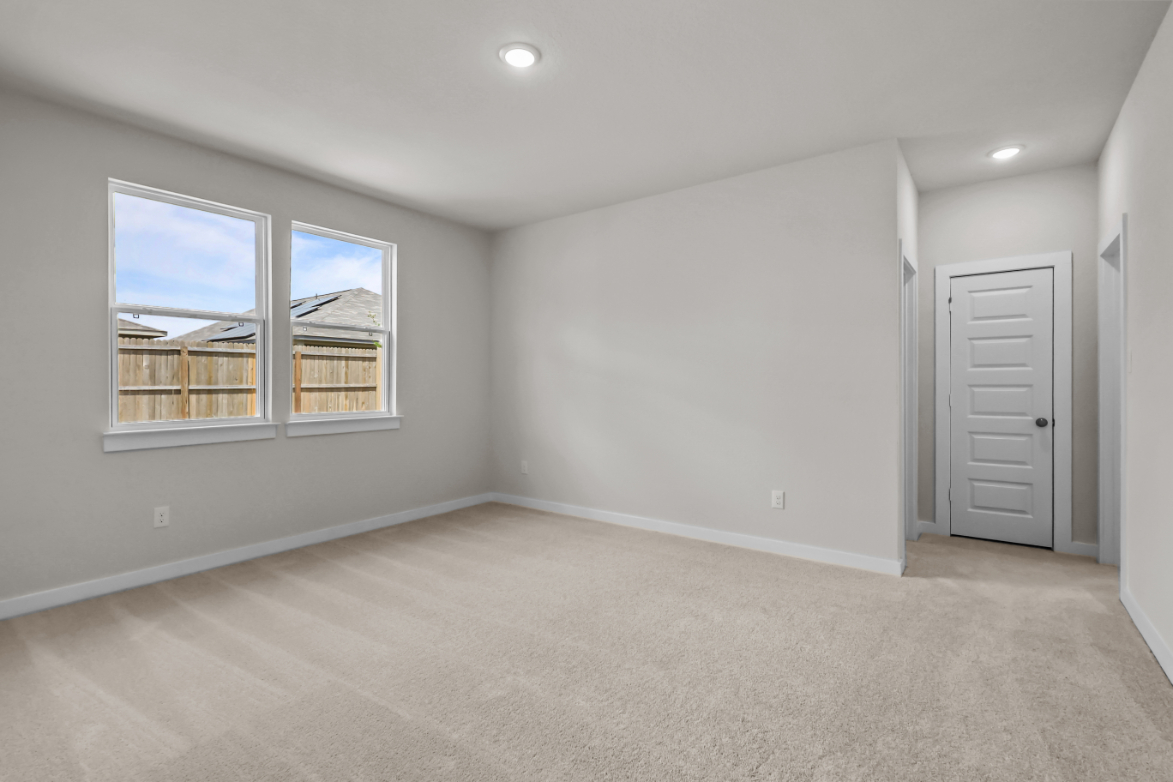 A room with a window and a door.
