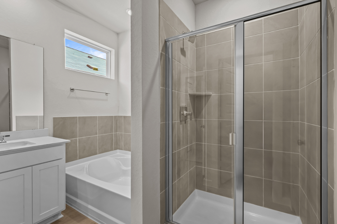 A bathroom with a glass shower.