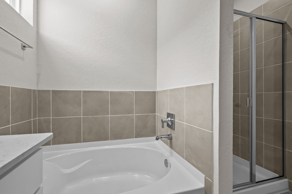 A bathroom with a glass shower.