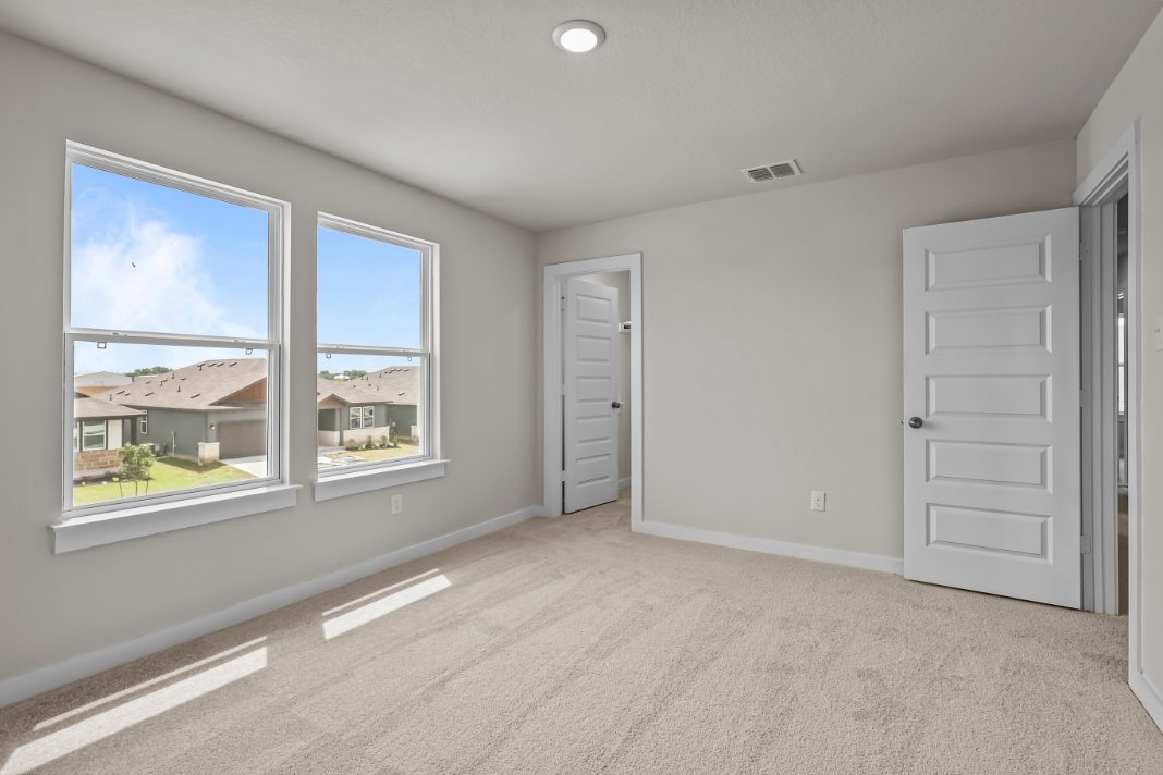 A room with a window and a door.