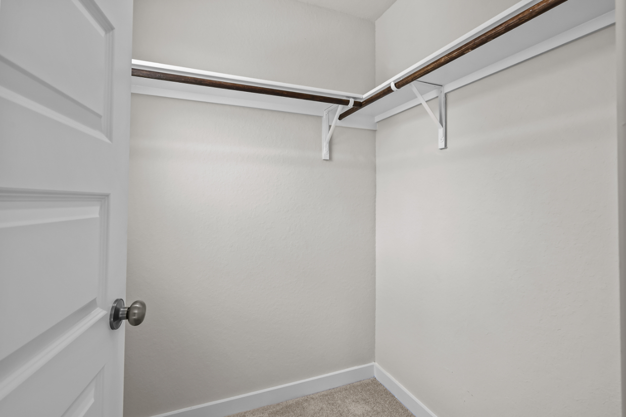 A white door with a metal railing.