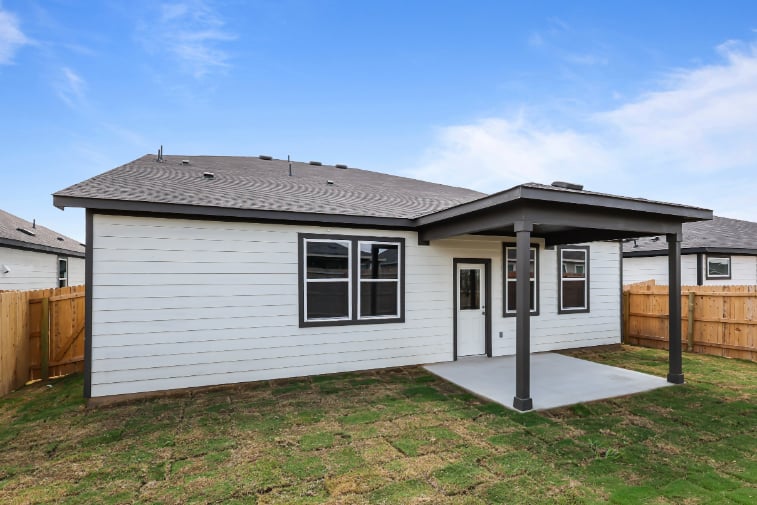 A house with a fence around it.