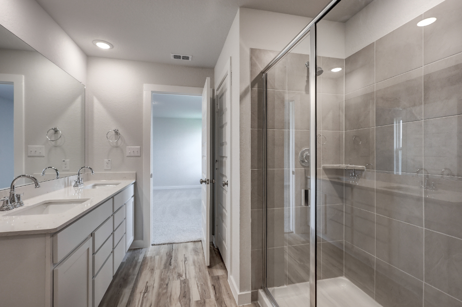 A bathroom with a glass shower.