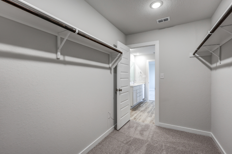 A hallway with white walls.