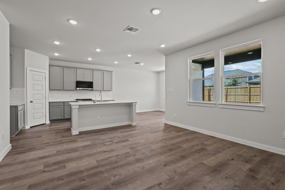 A large kitchen with white cabinets.