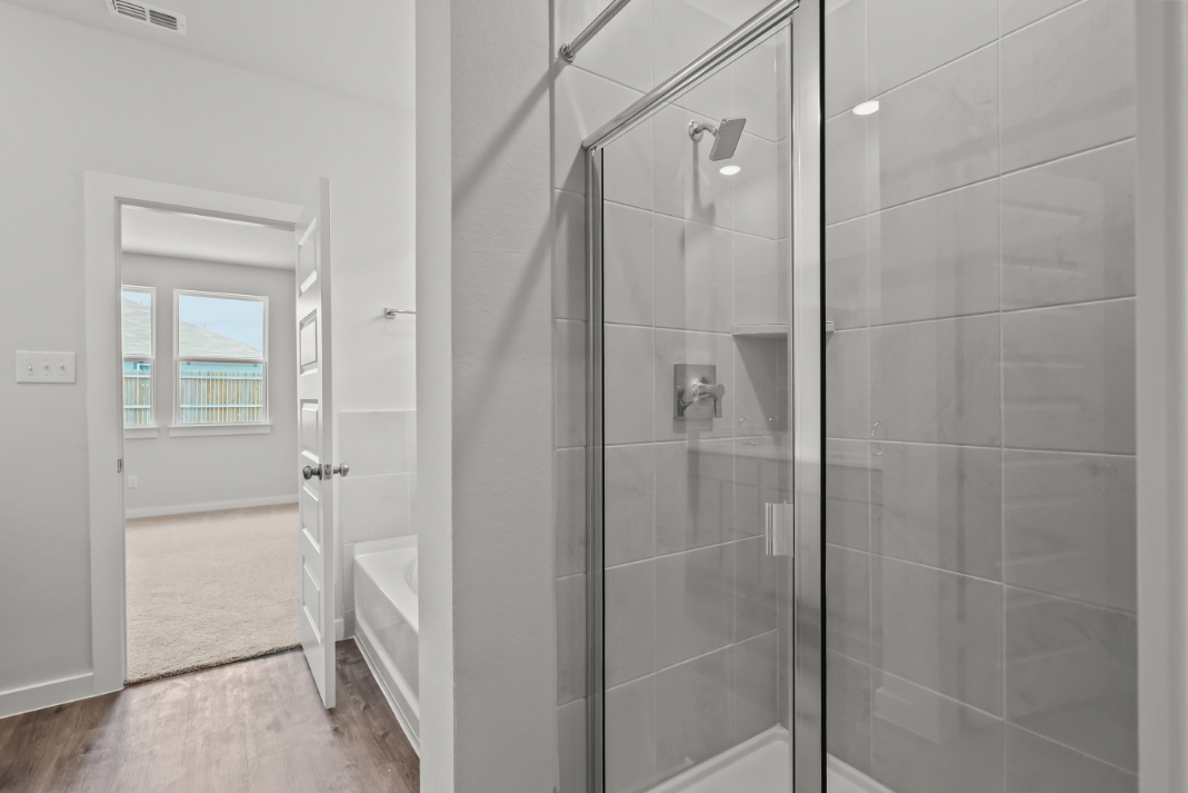A bathroom with a glass shower.