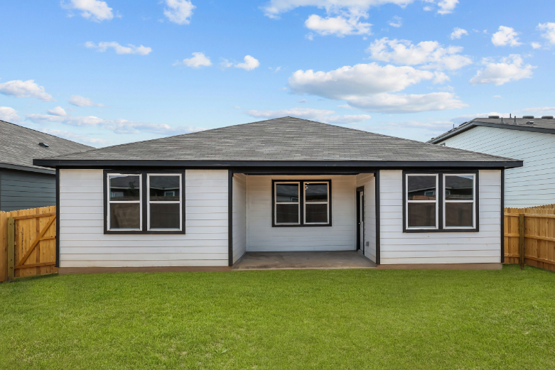 A house with a grass yard.