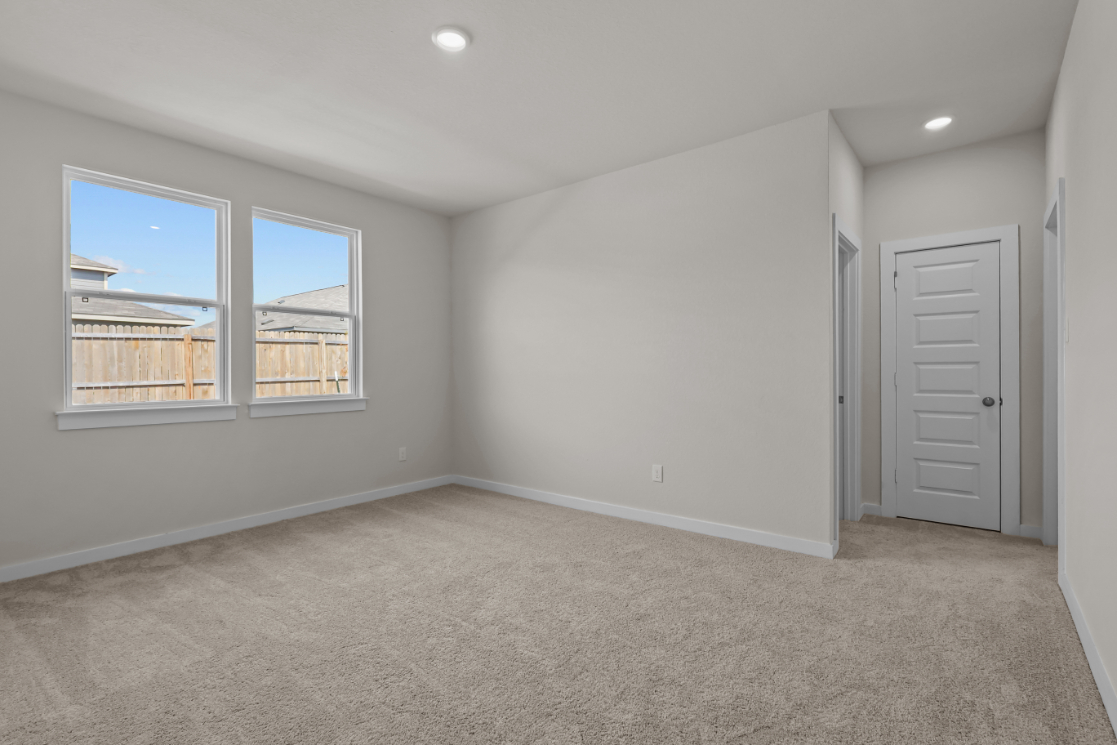 A room with a window and a door.