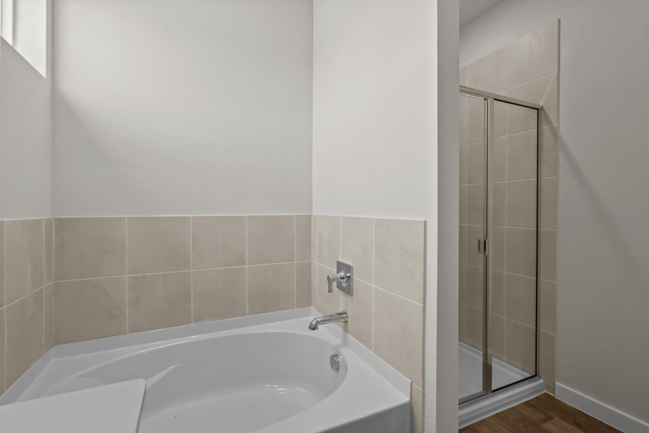 A bathroom with a glass shower.