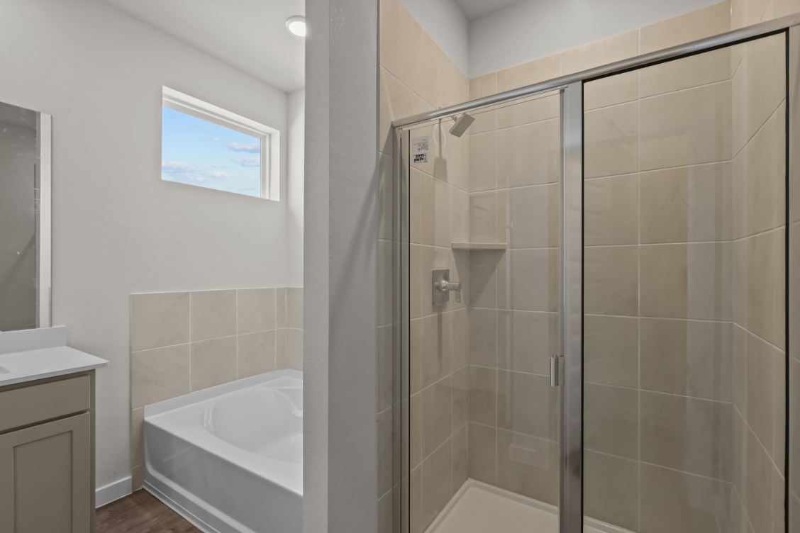 A bathroom with a glass shower.