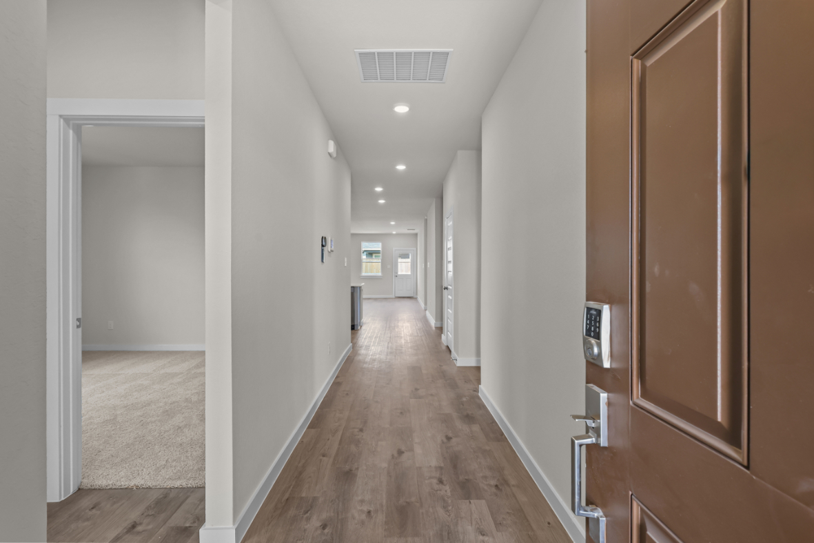 A hallway with wooden doors.