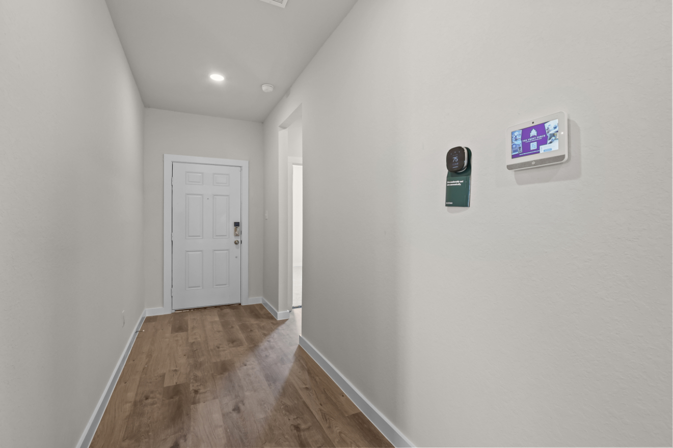 A hallway with white walls.