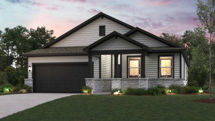 A house with a lawn in front of it.