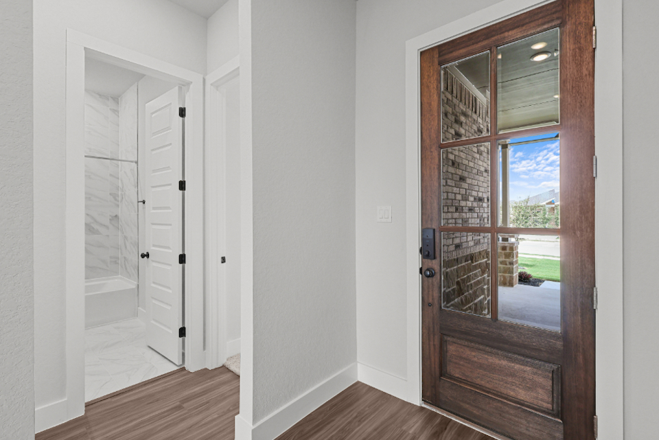 A room with a glass door.