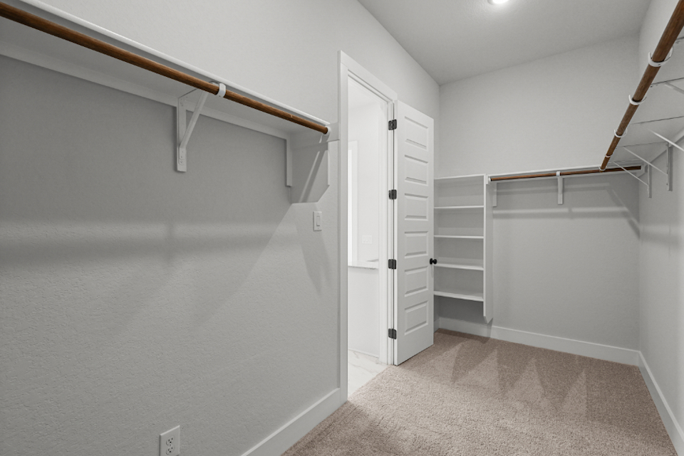 A white room with white cabinets.