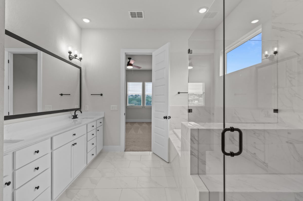 A bathroom with a glass shower.