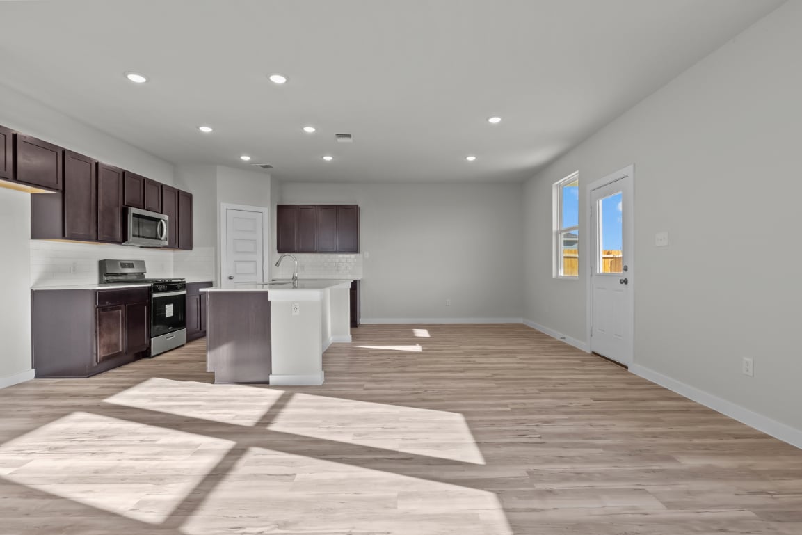 A kitchen with wooden floors.
