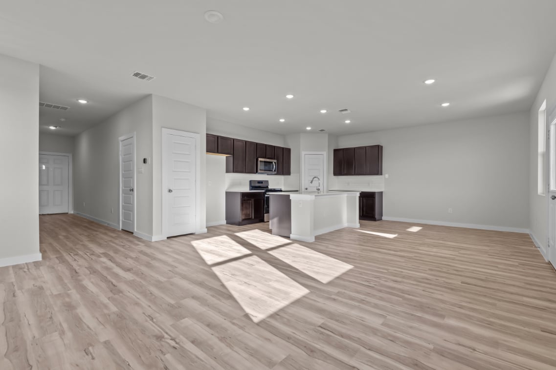 A large kitchen with white cabinets.