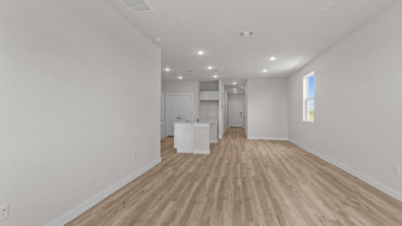 A long hallway with white walls.