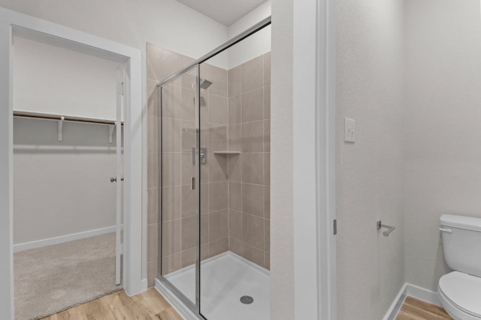 A bathroom with a glass shower.