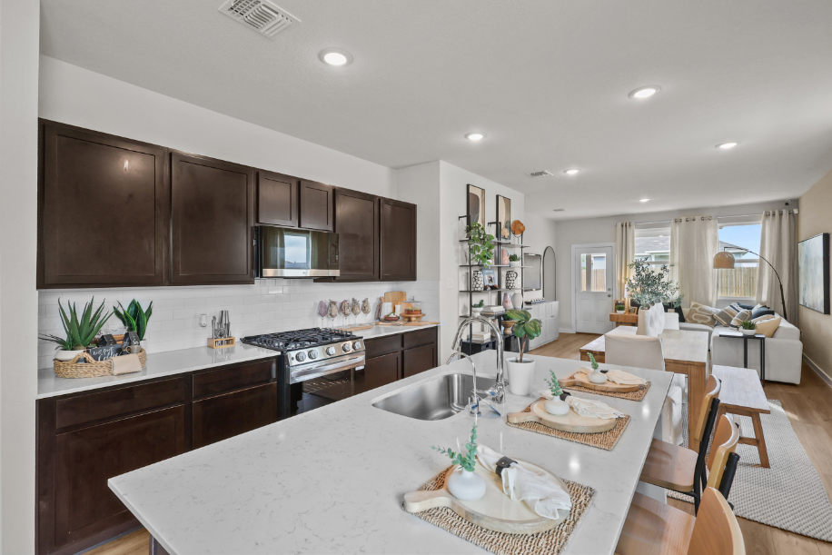 A kitchen with a marble island.