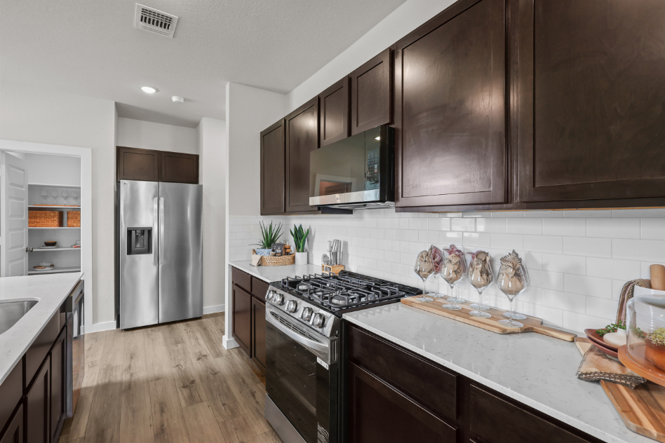 A kitchen with a stove and oven.