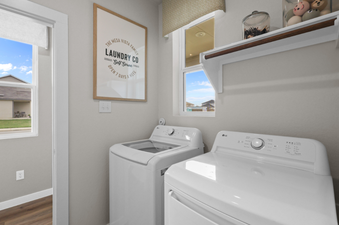 A washing machine in a room.